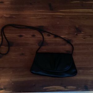 La Regale Black Curved-Flap Crossbody Bag